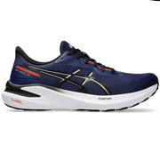 Blue running shoe with white sole on a white background
