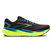 Black running shoe with neon yellow sole on a white background