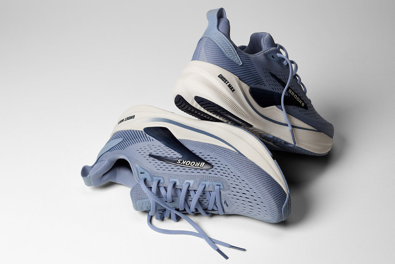 A pair of Nike Air Max 2013 sneakers in a dusty blue and white colorway, displayed on a clean light gray studio background.