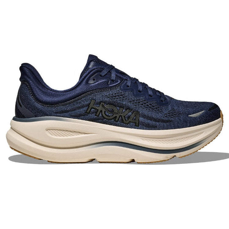 Navy running shoe with beige sole on a white background
