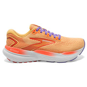 Orange running shoe with purple laces on a white background