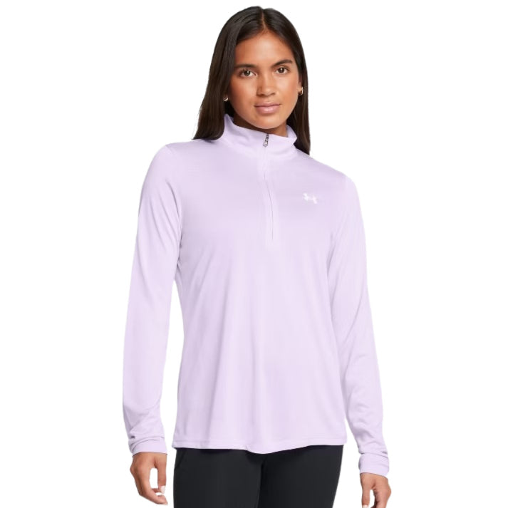 Woman wearing a light purple long-sleeve athletic top on a white background