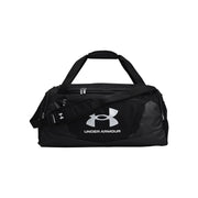 Under Armour duffel bag in heather gray and black with dual top handles, a detachable shoulder strap, and a matching gray pouch, shown on a light gray background.