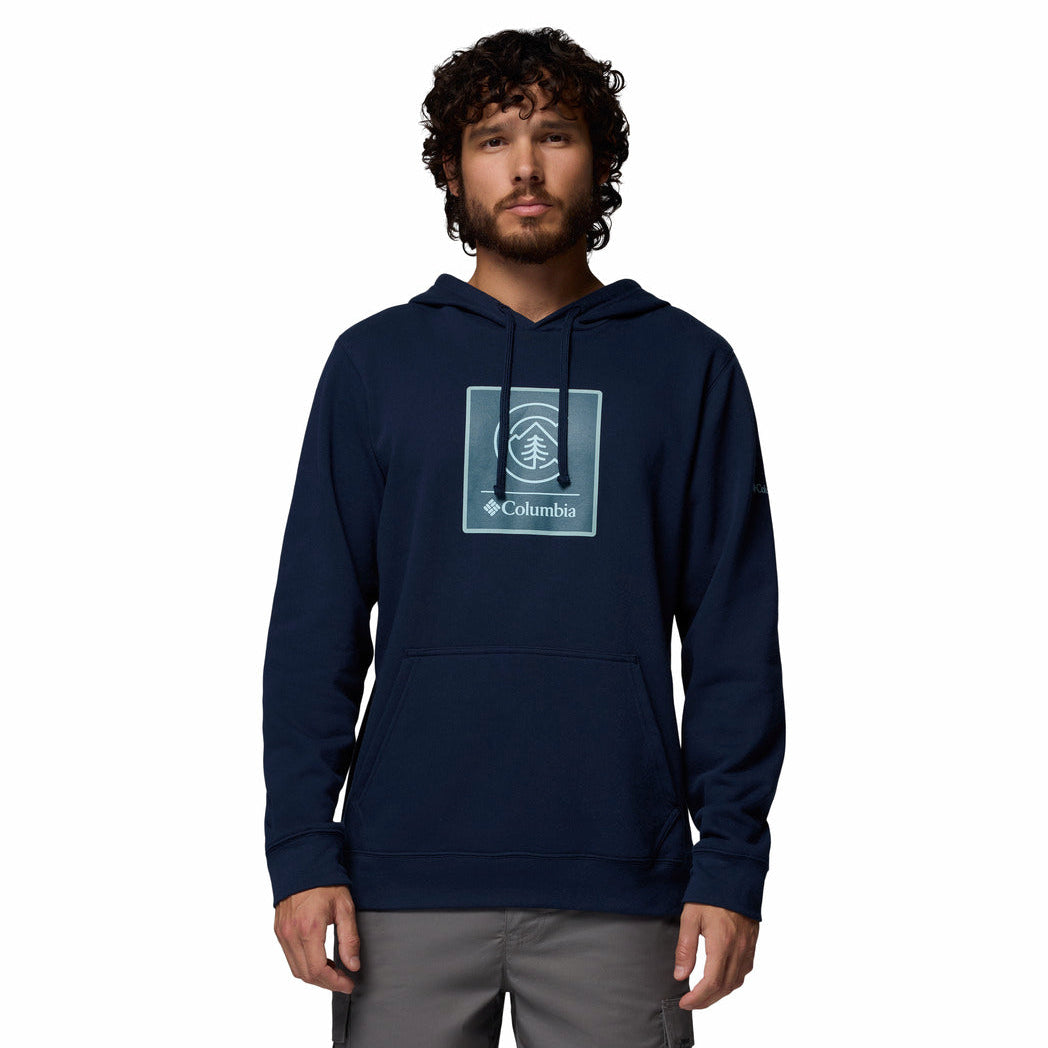 Man wearing a navy blue hoodie with Columbia logo on a white background