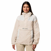 Woman wearing a beige Columbia jacket on a white background