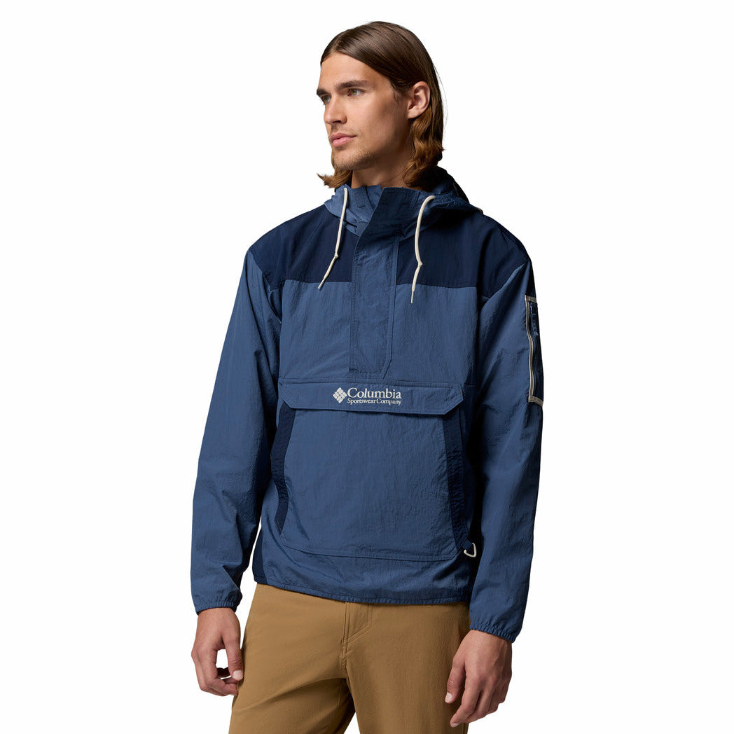 Man wearing a blue Columbia jacket on a white background