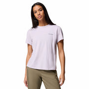 Woman wearing a white t-shirt with a brand logo on a white background