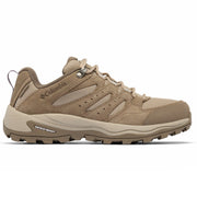 A single Columbia hiking shoe in a warm tan and beige colorway, shown from the side against a plain white background.