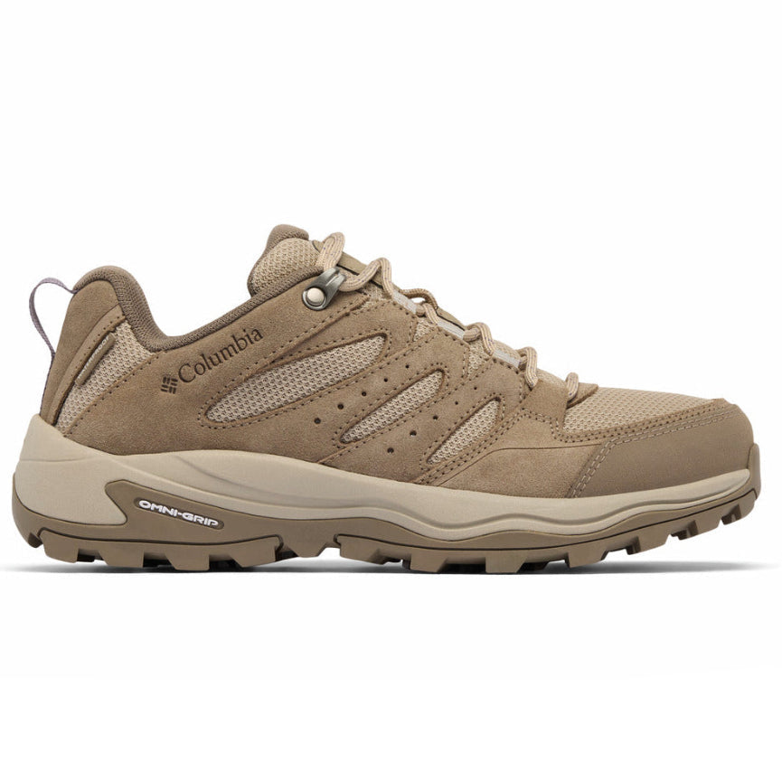 A single Columbia hiking shoe in a warm tan and beige colorway, shown from the side against a plain white background.