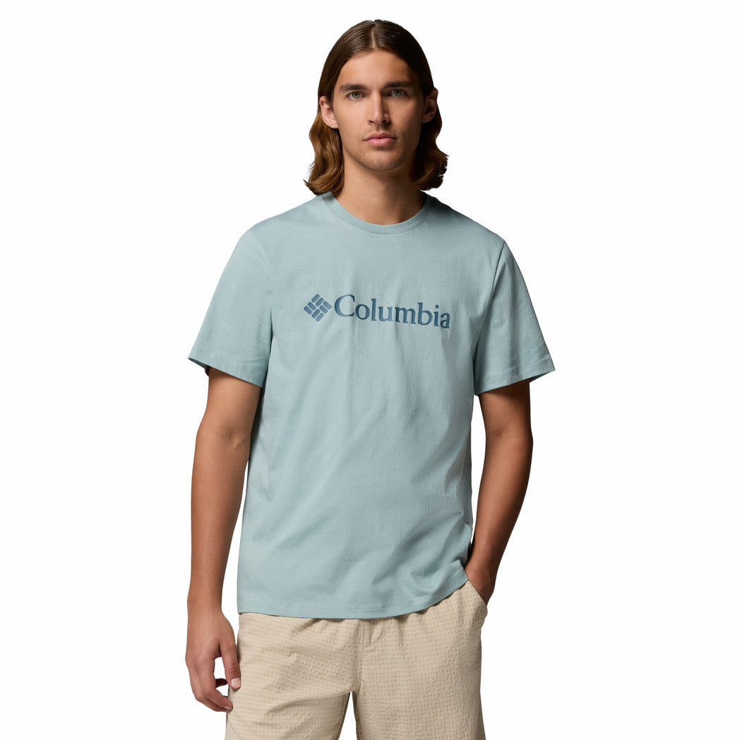 Man wearing a light blue Columbia t-shirt on a white background