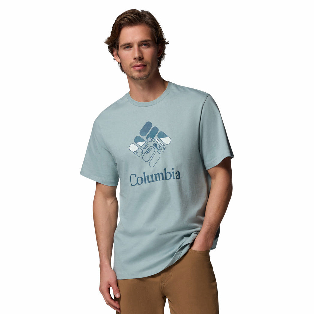 Man wearing a light blue Columbia t-shirt on a white background