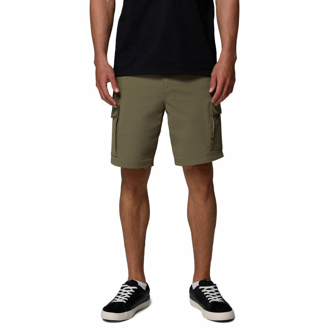 Person wearing olive green cargo shorts on a white background