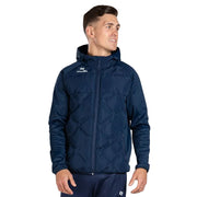 Man wearing a navy blue jacket with a brand logo on a gray background