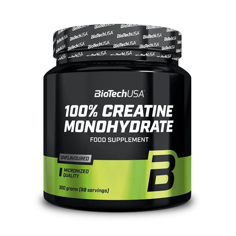 BioTechUSA 100% Creatine Monohydrate food supplement in a black plastic jar with a black and lime green label, sealed with a branded BioTechUSA tape lid, on a white background.