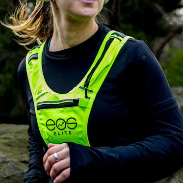 Person wearing a yellow running vest with product details on the right
