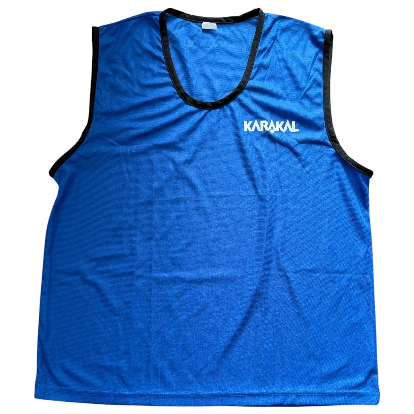 Blue sleeveless shirt with 'Karakal' branding on a white background