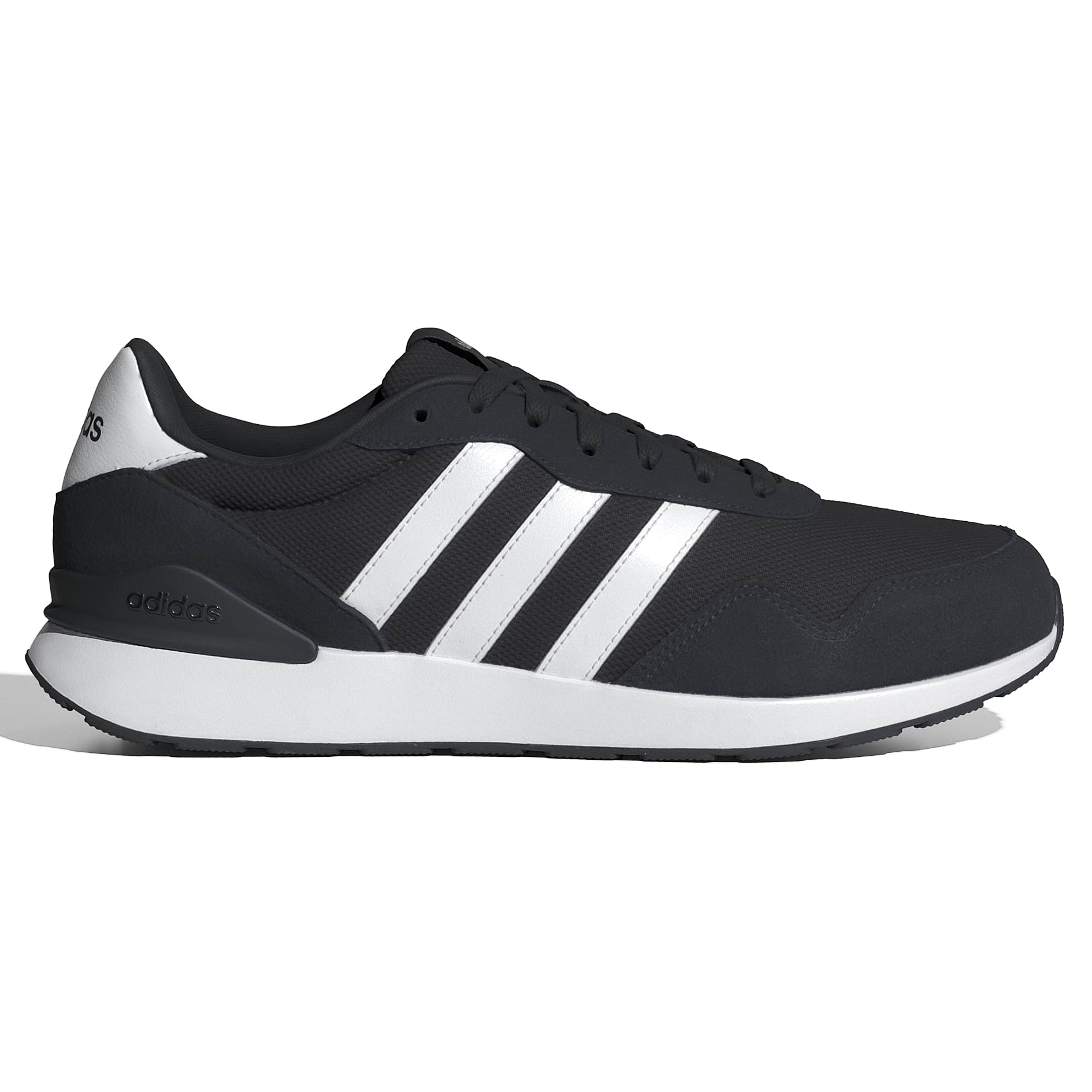 Green Adidas sneaker with white stripes on a light gray background
