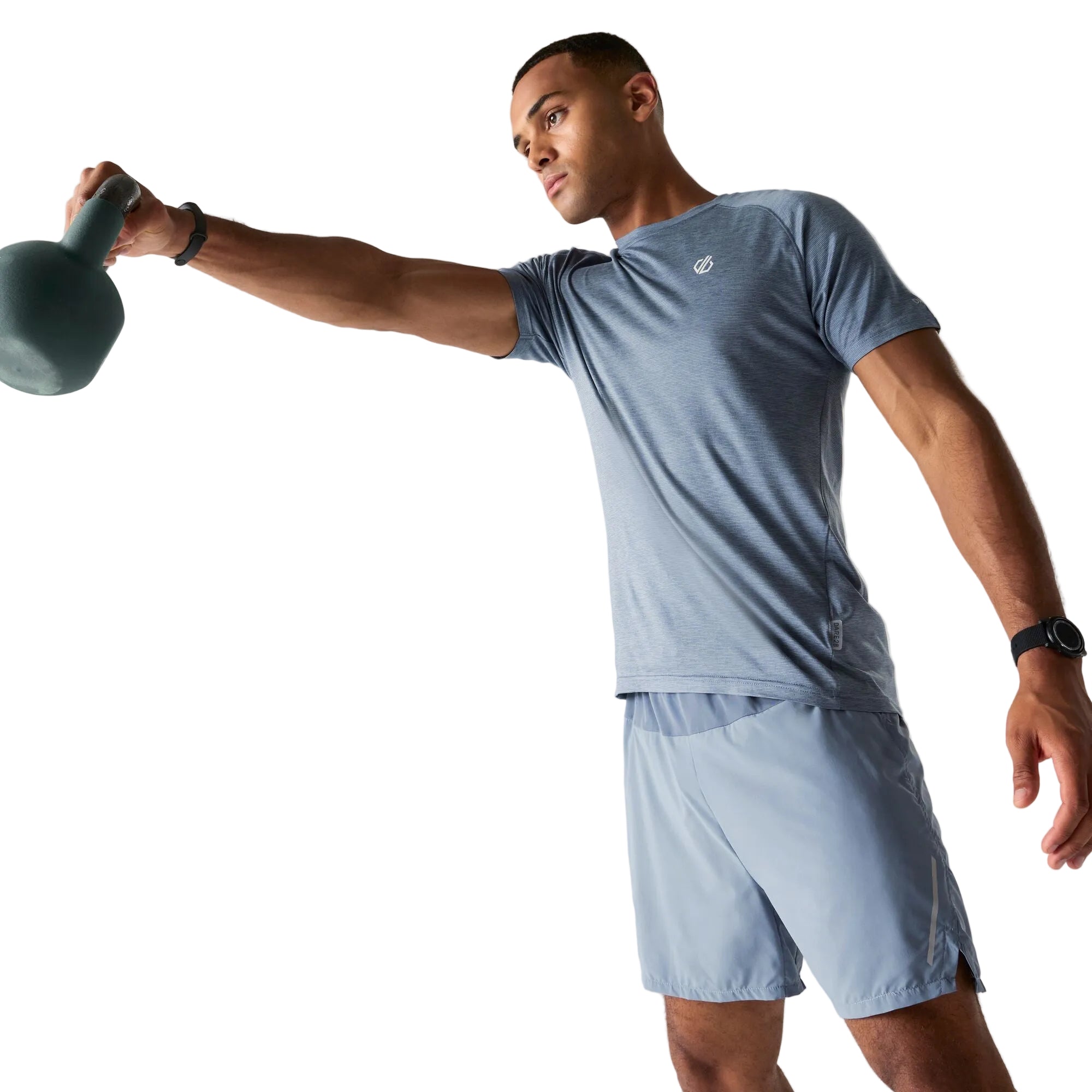 Man exercising with a kettlebell wearing a light blue athletic outfit.