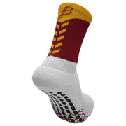 Multicolored sock with white, red, yellow, and black design on a light gray background