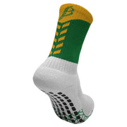 Green and yellow sock with black pattern on a white background