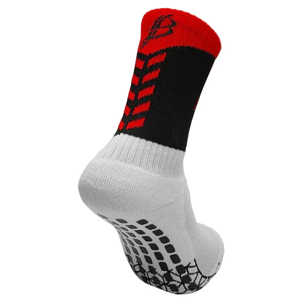 Black, red, and white sock with textured sole on a white background