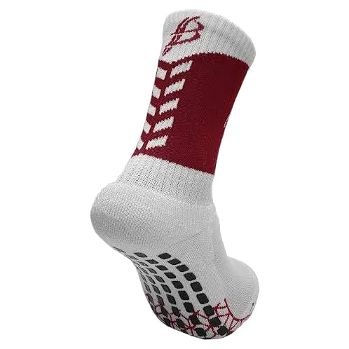 A single athletic crew sock shown on a light gray background. The sock is primarily white with a bold maroon block on the side, a white chevron pattern above the maroon section, a maroon logo near the cuff, and black grip dots on the sole.
