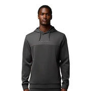 Man wearing a gray hoodie with 'Cassiope' branding on a white background