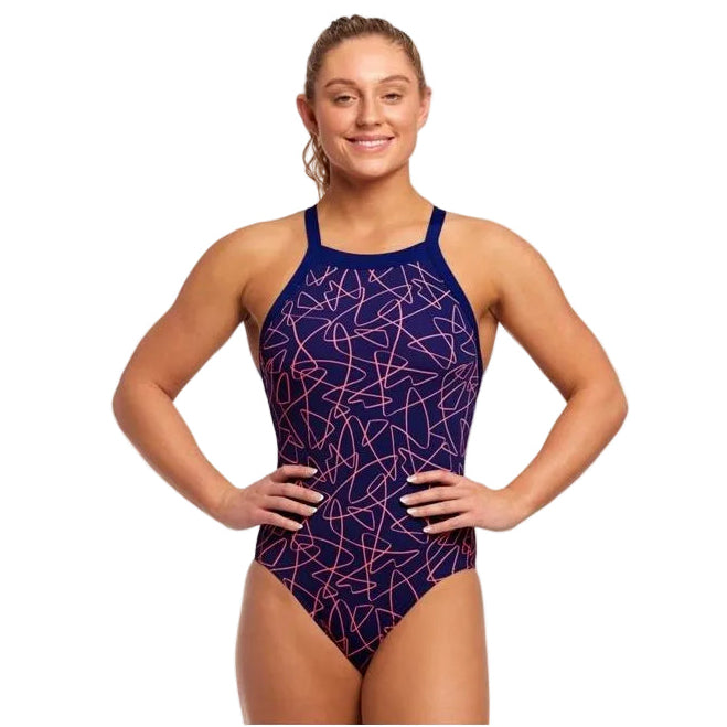Woman wearing a blue and pink patterned swimsuit on a white background