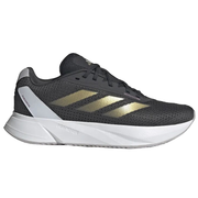 Black running shoe with gold stripes on a white background