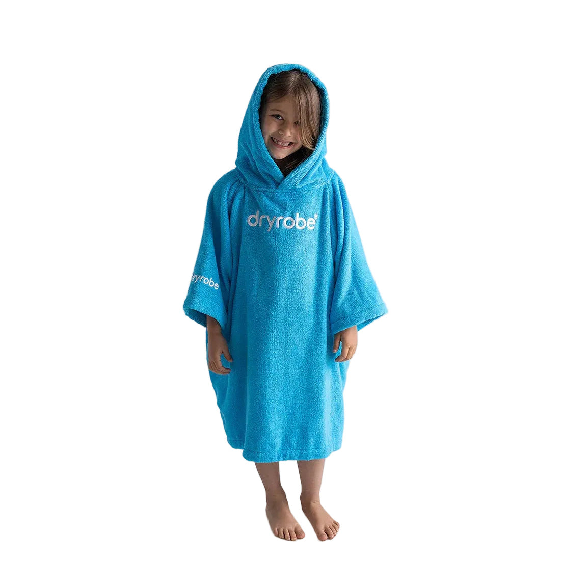 Child wearing a blue dryrobe poncho on a white background