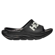 Black slide sandal with 'HOKA' branding on a white background