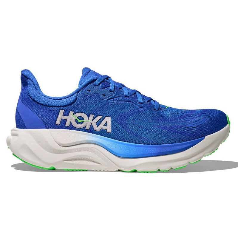 Blue running shoe with white sole on a white background