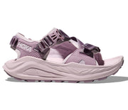 Pink sandal with black straps on a white background