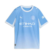 A light blue gradient Manchester City football jersey with white Puma logos, the Manchester City crest, and 'ETIHAD AIRWAYS' sponsor text, shown on a plain white background.