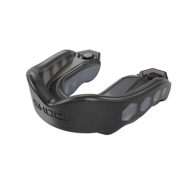 Black mouthguard with 'Shock Doctor' branding on a white background