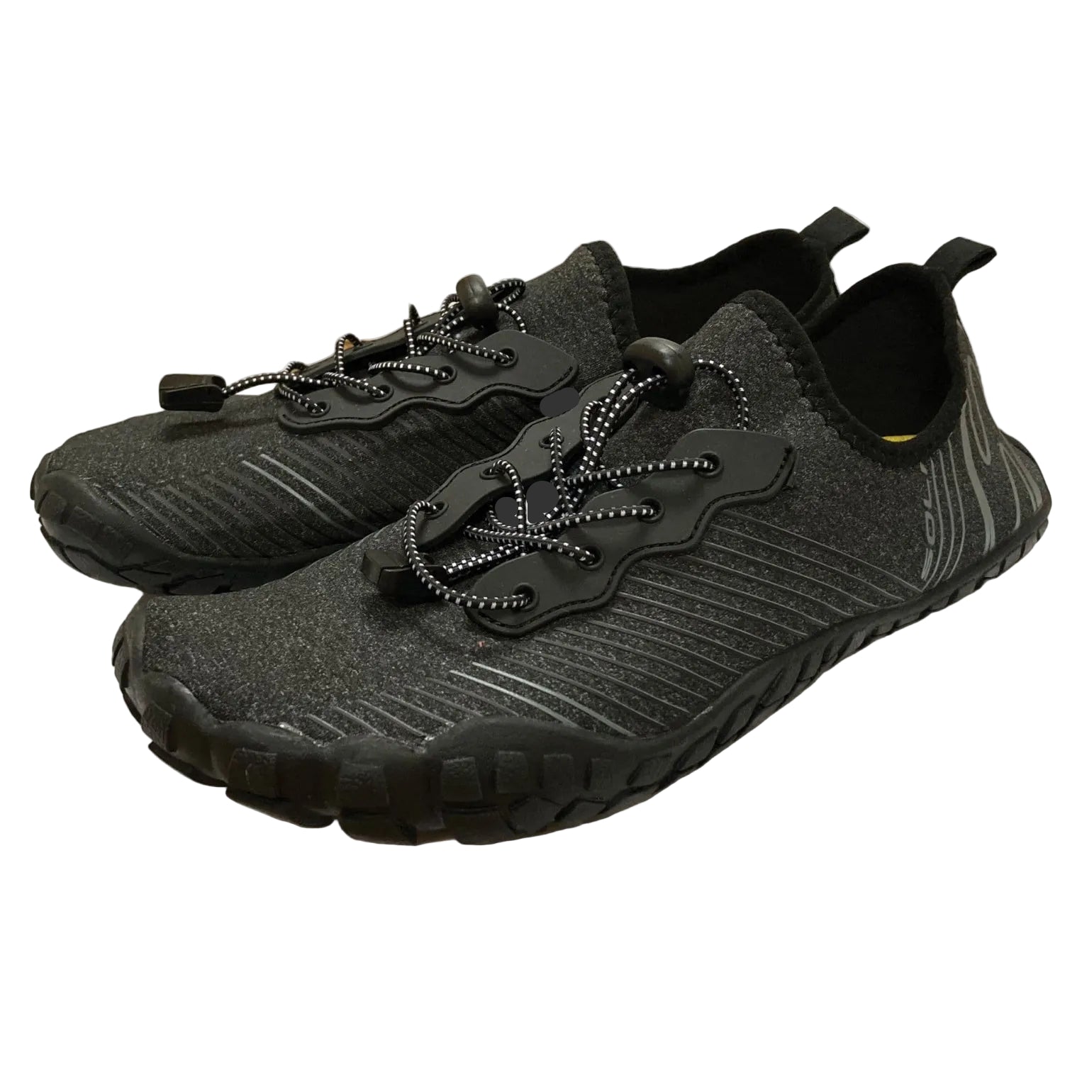 Black and gray shoes with unique sole design on a white background