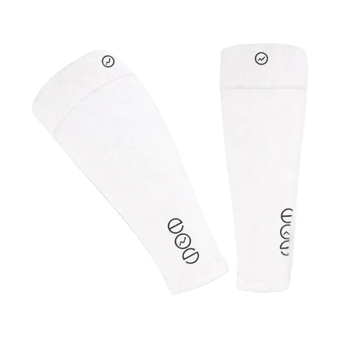 Two white shin guards with black logos on a light gray background